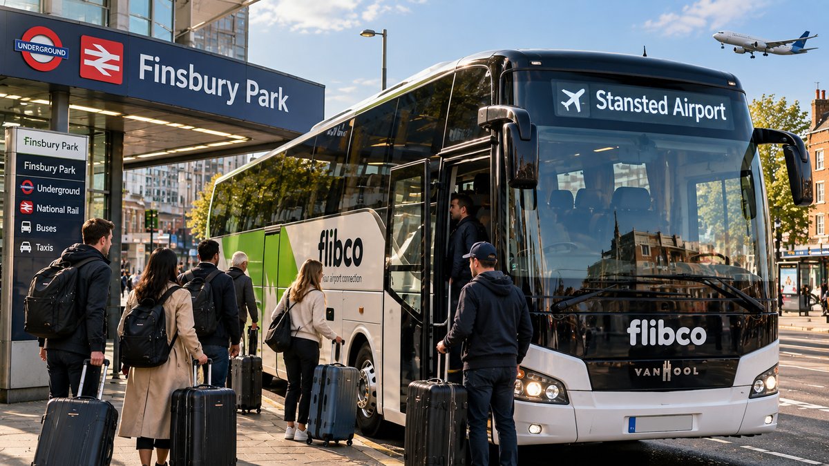 Passengers with suitcases boarding a Flibco coach to Stansted Airport outside Finsbury Park station